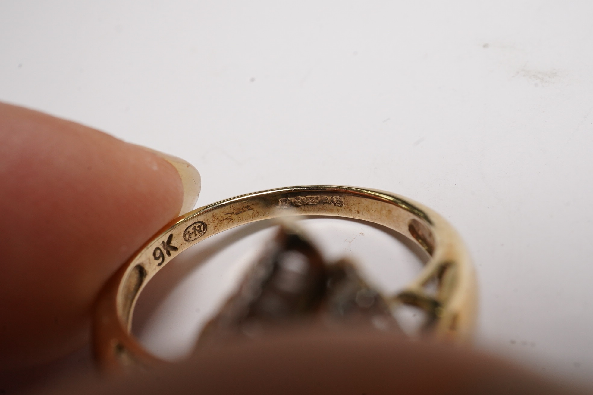 Two modern 9ct gold and diamond set rings, diamond chip cluster and five stone coloured diamond set half hoop, both size L, gross weight 6.4 grams. Condition - poor to fair